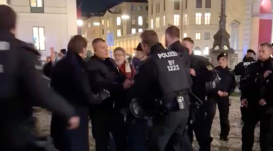 Police intervene at a protest in Munich.